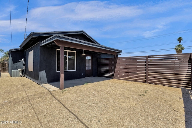 exterior space with central air condition unit and a patio