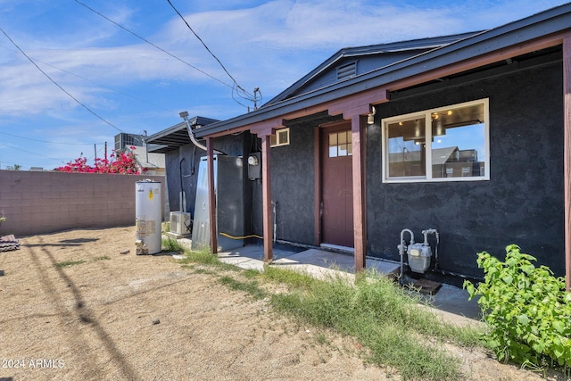 doorway to property featuring water heater