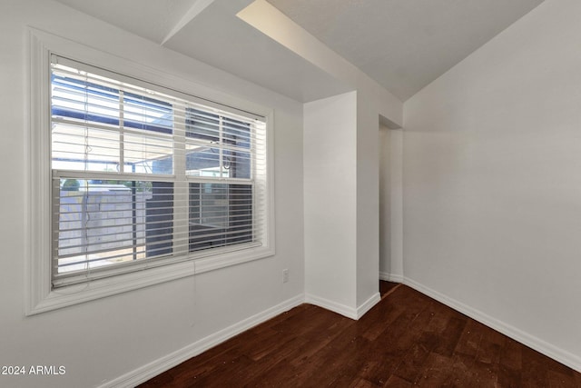 spare room with dark wood-type flooring