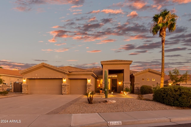 prairie-style home featuring a garage