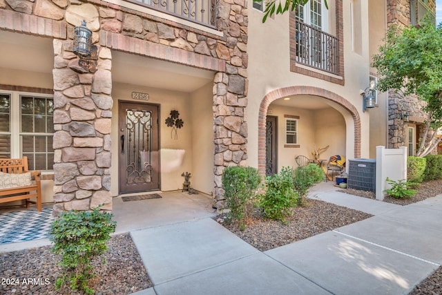 entrance to property featuring central AC