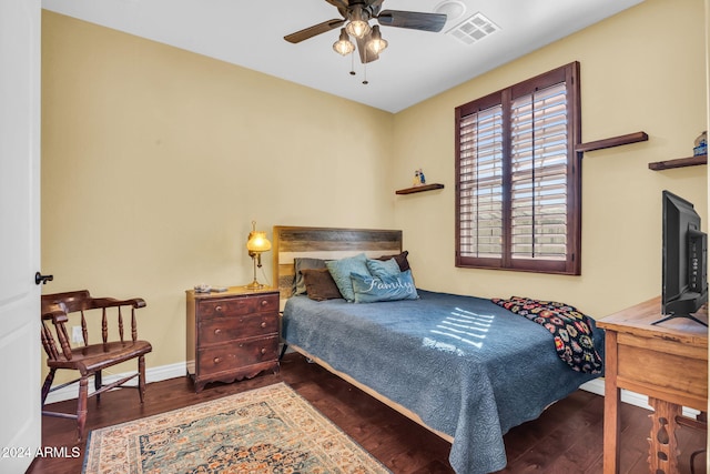 bedroom featuring ceiling fan and dark wood-type flooring