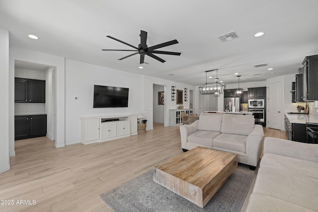 4346 S Synapse Dr, Mesa, AZ 85212 - living area featuring ceiling fan, recessed lighting, and light wood-type flooring