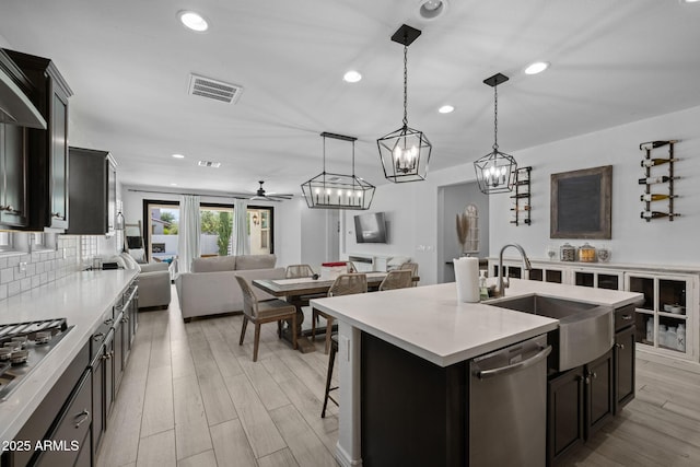 4346 S Synapse Dr, Mesa, AZ 85212 - kitchen featuring appliances with stainless steel finishes, open floor plan, light countertops, and recessed lighting