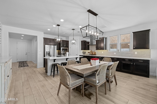 4346 S Synapse Dr, Mesa, AZ 85212 - dining room with recessed lighting, light wood-style floors, and a chandelier