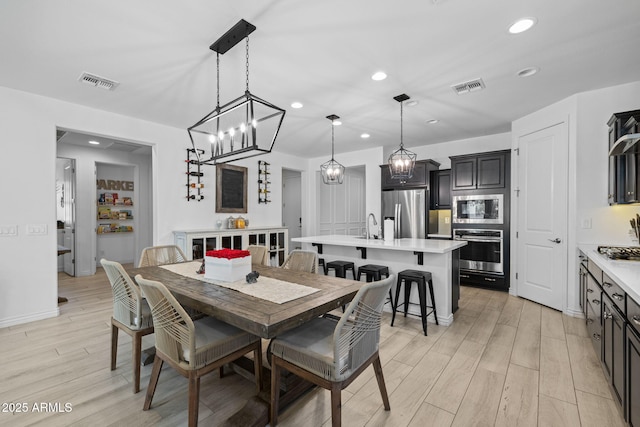 4346 S Synapse Dr, Mesa, AZ 85212 - dining area with light wood-style floors and recessed lighting