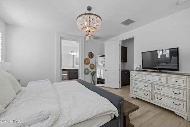 4346 S Synapse Dr, Mesa, AZ 85212 - bedroom with a chandelier, light wood finished floors, and ensuite bathroom