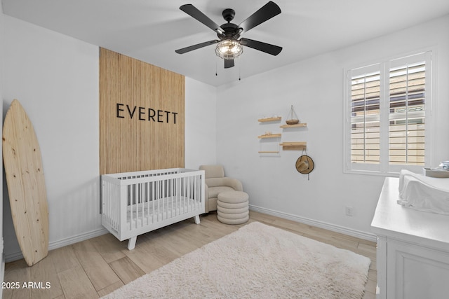 4346 S Synapse Dr, Mesa, AZ 85212 - bedroom featuring wood finished floors, a nursery area, and ceiling fan