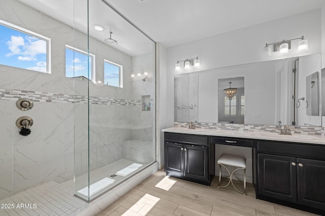 4346 S Synapse Dr, Mesa, AZ 85212 - full bath featuring double vanity, tiled shower, tasteful backsplash, and wood finished floors