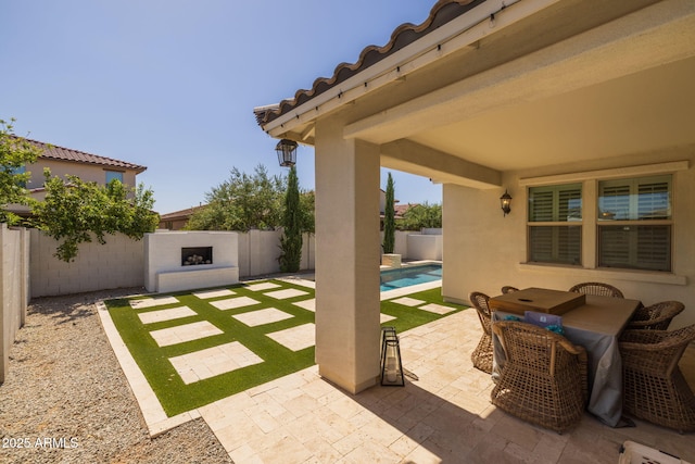 4346 S Synapse Dr, Mesa, AZ 85212 - fenced backyard featuring a patio and outdoor dining space