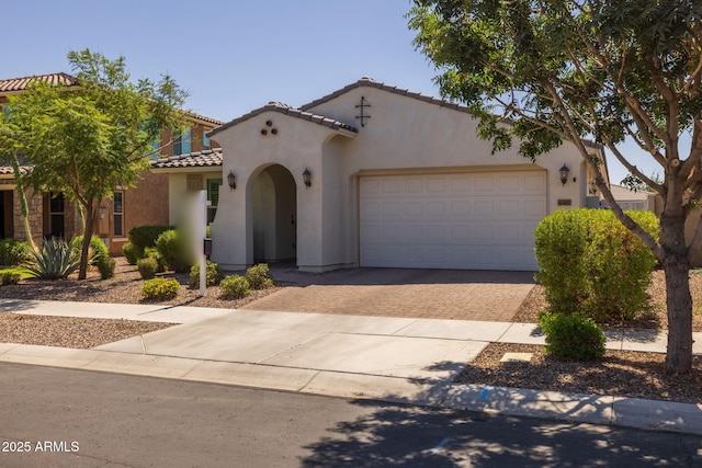 4346 S Synapse Dr, Mesa, AZ 85212 - mediterranean / spanish-style house featuring decorative driveway, a tile roof, an attached garage, and stucco siding
