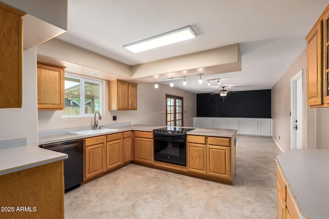 3010 E Cortez St, Phoenix, AZ 85028 - kitchen with dishwasher, a sink, black electric range, a peninsula, and a ceiling fan