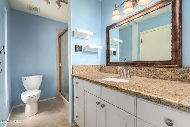 3010 E Cortez St, Phoenix, AZ 85028 - bathroom with toilet, a shower with shower door, vanity, tile patterned flooring, and baseboards