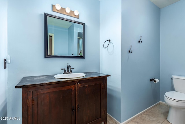 3010 E Cortez St, Phoenix, AZ 85028 - bathroom with toilet, vanity, tile patterned floors, and baseboards