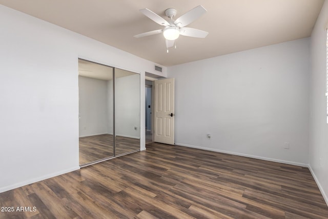 3010 E Cortez St, Phoenix, AZ 85028 - unfurnished bedroom featuring wood finished floors, a closet, baseboards, and ceiling fan