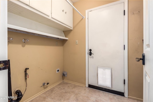 3010 E Cortez St, Phoenix, AZ 85028 - laundry area with gas dryer hookup, cabinet space, light tile patterned floors, and baseboards