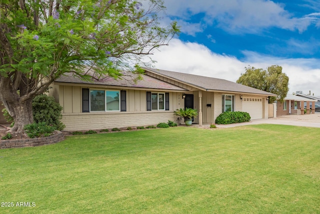 3010 E Cortez St, Phoenix, AZ 85028 - ranch-style house with board and batten siding, an attached garage, brick siding, driveway, and a front yard