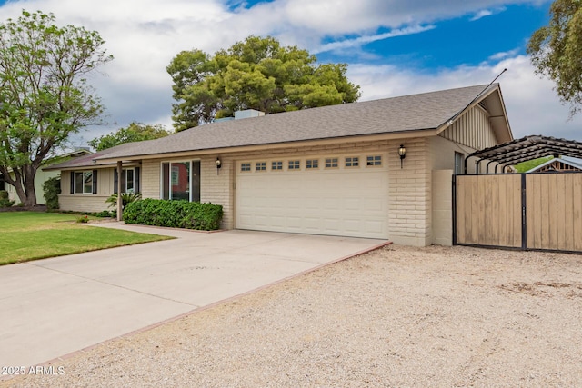 3010 E Cortez St, Phoenix, AZ 85028 - single story home with brick siding, a garage, concrete driveway, and a front lawn