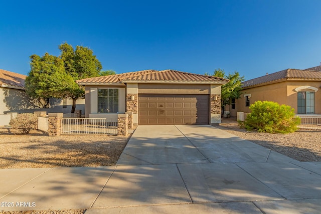 20919 E Desert Hills Blvd, Queen Creek, AZ 85142 - mediterranean / spanish-style home featuring driveway, stucco siding, an attached garage, and stone siding