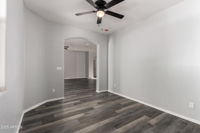 20919 E Desert Hills Blvd, Queen Creek, AZ 85142 - spare room with a ceiling fan, arched walkways, and dark wood-style flooring