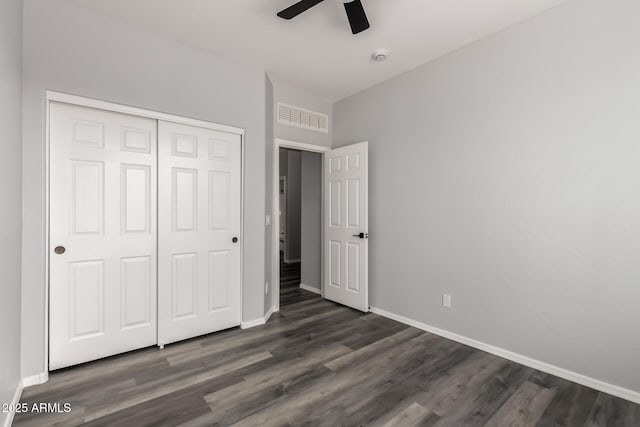 20919 E Desert Hills Blvd, Queen Creek, AZ 85142 - unfurnished bedroom with dark wood-style flooring, a closet, and ceiling fan