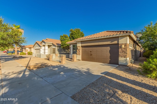 20919 E Desert Hills Blvd, Queen Creek, AZ 85142 - mediterranean / spanish-style house with stucco siding, an attached garage, concrete driveway, a tile roof, and a residential view