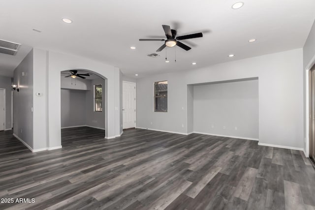 20919 E Desert Hills Blvd, Queen Creek, AZ 85142 - unfurnished living room with a ceiling fan, recessed lighting, arched walkways, and dark wood-style floors