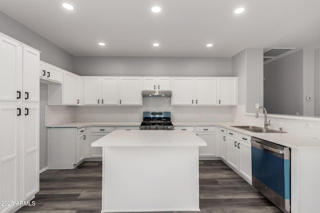 20919 E Desert Hills Blvd, Queen Creek, AZ 85142 - kitchen featuring dishwashing machine, stainless steel range, under cabinet range hood, light countertops, and decorative backsplash