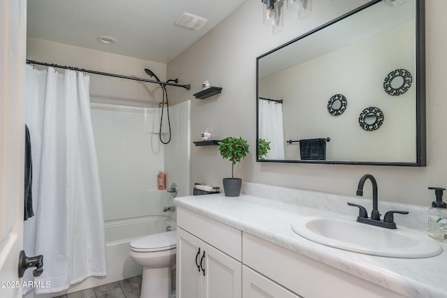 bathroom with toilet, shower / tub combo, visible vents, and vanity