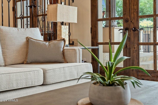 sitting room with french doors and a healthy amount of sunlight