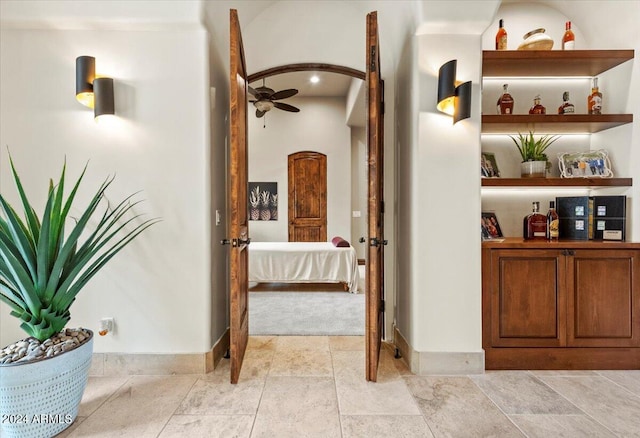 hallway featuring baseboards