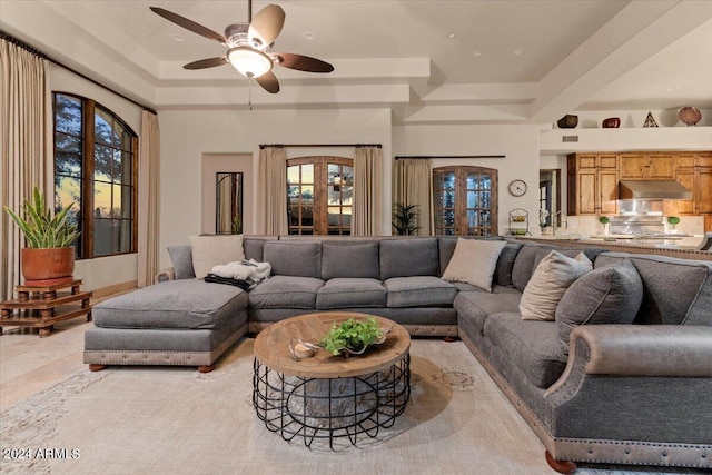 living room with light tile patterned flooring, ceiling fan, and french doors