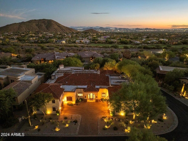 aerial view at dusk with a mountain view