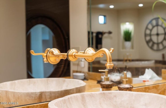 interior details with a sink and recessed lighting