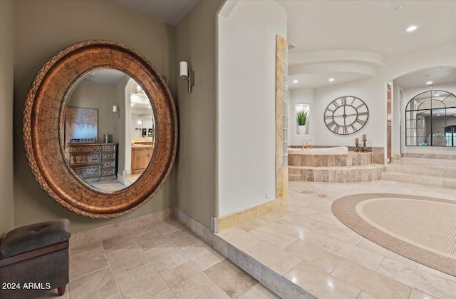 interior space featuring tiled bath