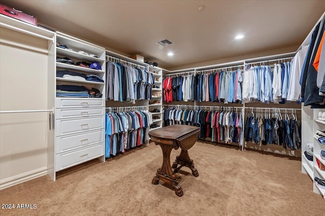 spacious closet with carpet flooring and visible vents