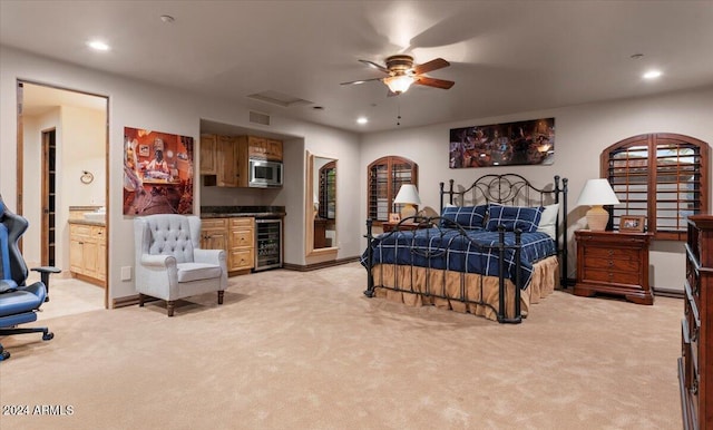 bedroom featuring recessed lighting, a bar, visible vents, wine cooler, and light colored carpet