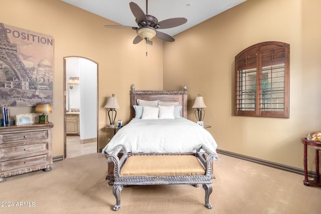 bedroom featuring carpet, ensuite bathroom, and baseboards