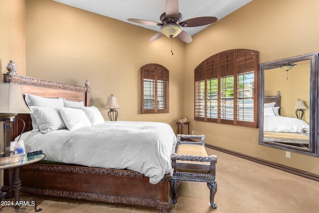 bedroom featuring ceiling fan and light colored carpet