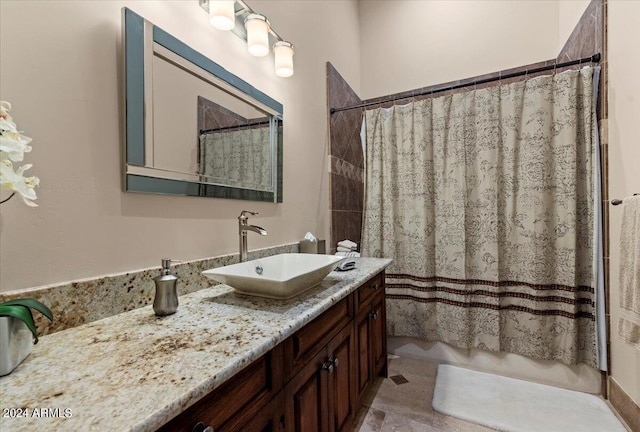full bathroom featuring shower / bath combination with curtain and vanity