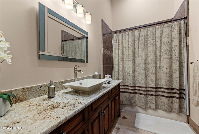 bathroom with shower / bath combo and vanity