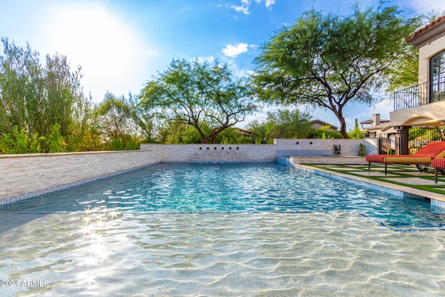 view of swimming pool with a patio