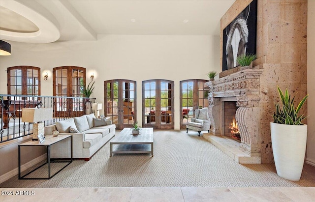 living room with a towering ceiling and french doors