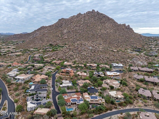 birds eye view of property with a mountain view