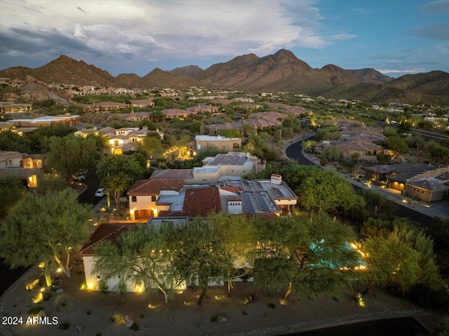 aerial view at dusk with a mountain view