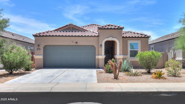 36467 W Pampoloma Ave, Maricopa, AZ 85138 - mediterranean / spanish house with an attached garage, stucco siding, a tiled roof, and concrete driveway