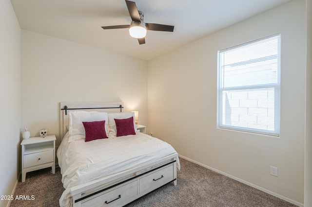 36467 W Pampoloma Ave, Maricopa, AZ 85138 - bedroom featuring dark colored carpet, multiple windows, baseboards, and ceiling fan