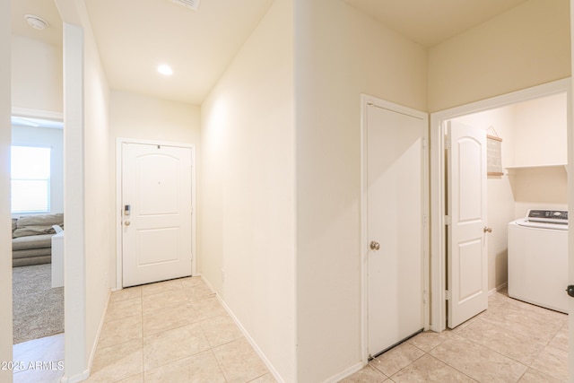 36467 W Pampoloma Ave, Maricopa, AZ 85138 - corridor featuring washer / dryer, light tile patterned flooring, and baseboards