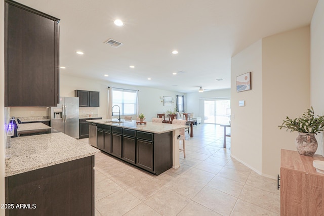 36467 W Pampoloma Ave, Maricopa, AZ 85138 - kitchen featuring stainless steel fridge with ice dispenser, a sink, a center island with sink, a ceiling fan, and recessed lighting