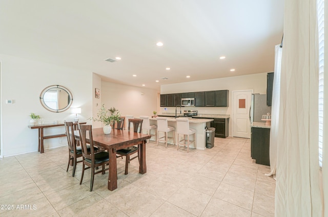 36467 W Pampoloma Ave, Maricopa, AZ 85138 - dining room featuring light tile patterned flooring and recessed lighting